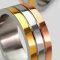 Elegant tri-color gold rings showcasing modern design, perfect for engagements or weddings.